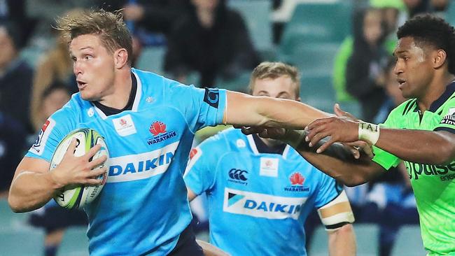 The Waratahs Michael Hooper looks for support.