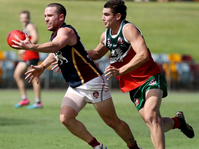 AFL Seniors: Elimination Final South Cairns v Cairns City Lions at Cazalys. Lions' Ashton Hams and Cutters' Shaun Ayling. Picture: Stewart McLean