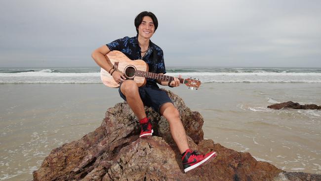 Bobby Holmes right at home following the release of his new single about surfing and the Gold Coast. Picture Glenn Hampson