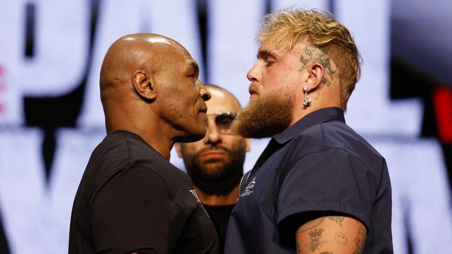 Mike Tyson and Jake Paul speak onstage at the official press conference. Photo by Sarah Stier/Getty Images for Netflix.