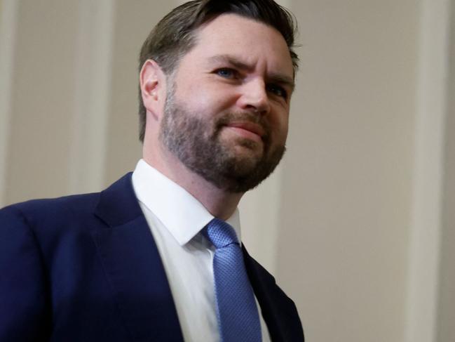 US Vice-President elect JD Vance arrives to pay his respects in front of the flag-draped casket at the Lying in State Ceremony for former President Jimmy Carter at the US Capitol Rotunda in Washington, DC on January 8, 2025. Carter, the 39th President of the United States, died at the age of 100 on December 29, 2024 at his home in Plains, Georgia. (Photo by Ting Shen / AFP)