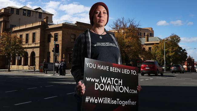 Animal rights protester Kristy Alger on the intersection of Murray and Macquarie streets in Hobart to promote a film exposing animal cruelty. Picture: NIKKI DAVIS-JONES