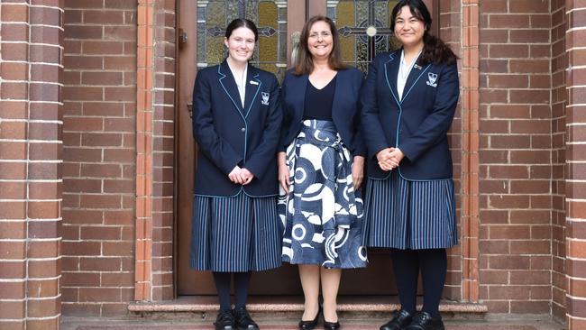 Our Lady of Mercy College Parramatta head girl Maeve Nolan and assistant head girl Moana Tuala with principal Lucie Farrugia.