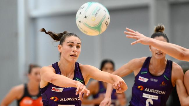 GOLD COAST, AUSTRALIA – FEBRUARY 25: Macy Gardner of the Firebirds passes the ball during the 2023 Team Girls Cup match between Giants Netball and Queensland Firebirds at Gold Coast Sports and Leisure Centre on February 25, 2023 in Gold Coast, Australia. (Photo by Matt Roberts/Getty Images)