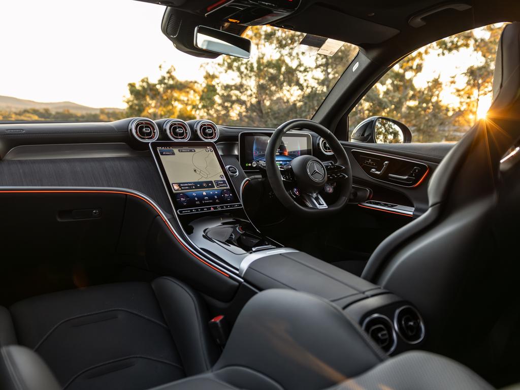 The GLC 43’s cabin is snug, sporty and full of tech. Note the “happy dad” dials on the lower half of the chunky flat-bottomed steering wheel.