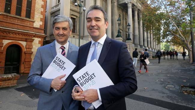 SA Treasurer Rob Lucas and Premier Steven Marshall with the 2019 Budget. Picture: AAP / Kelly Barnes