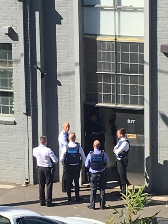 Police raided a Port Melbourne property owned by Mark Bomber Thompson.