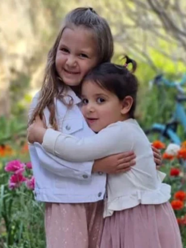 The girls – Aviv (right) and Raz (left) – were released with their mother during the temporary truce. Picture: Supplied.