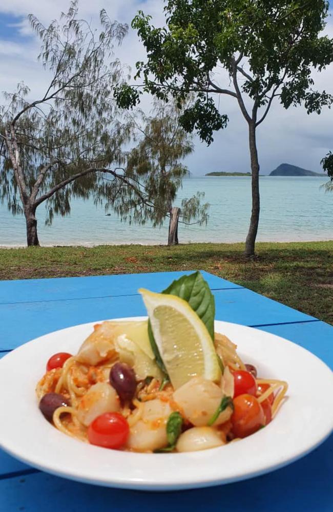 A chef speciality of spaghetti with scallops served up at the Dingo Beach Hotel in the Whitsundays which has stunning views of the ocean. Picture: Dingo Beach Hotel