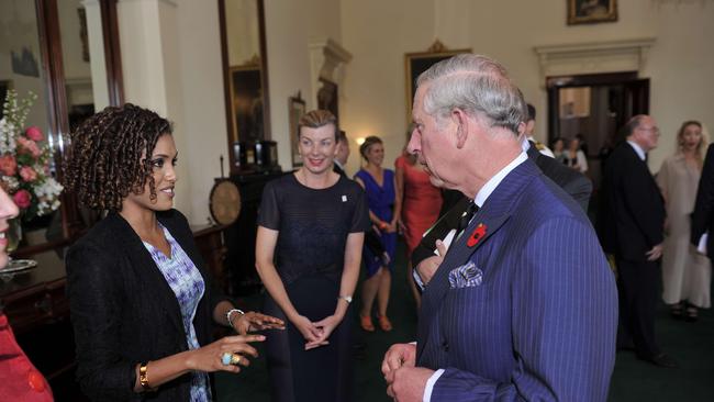 Karina Carvalho meeting the then Prince Charles in 2012.