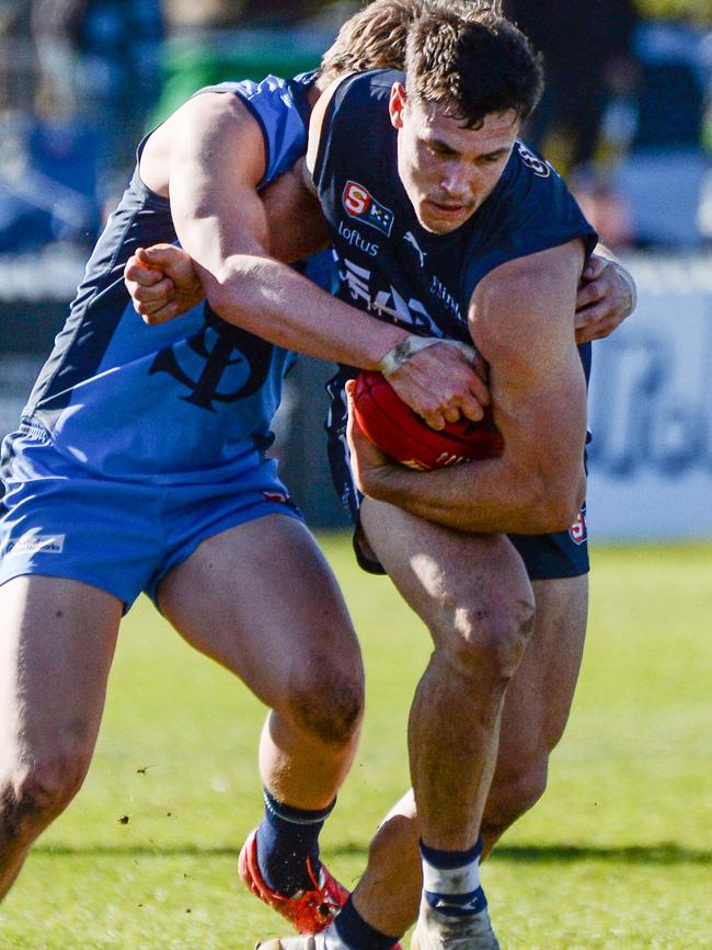 South Adelaide’s Liam Fitt tries to break a tackle against Sturt at Unley Oval on Saturday. Picture: Brenton Edwards.