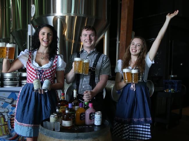 Charlotte James, Rob Sheedy and Jasmin Knoetsch get ready to celebrate Oktoberfest at Hemingway's Brewery Cairns Wharf on Saturday, September 28. Photo: Catherine Duffy.