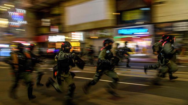 Riot police charge protesters on Wednesday night during the biggest demonstration of the year in Hong Kong. Picture: AFP