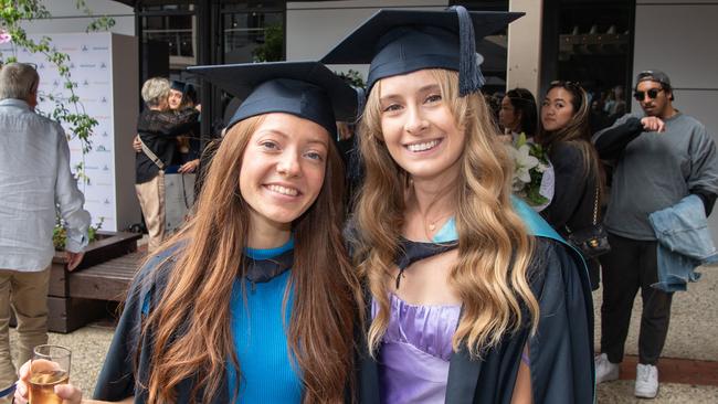 Samantha Ackerly and Melanie De Laine celebrate graduation. Picture: Brad Fleet