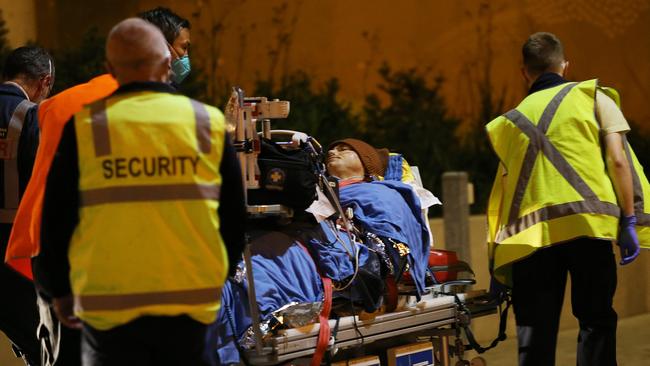 Paramedics take shark attack victim Joe Hoffman to John Hunter Hospital. Picture: Peter Lorimer