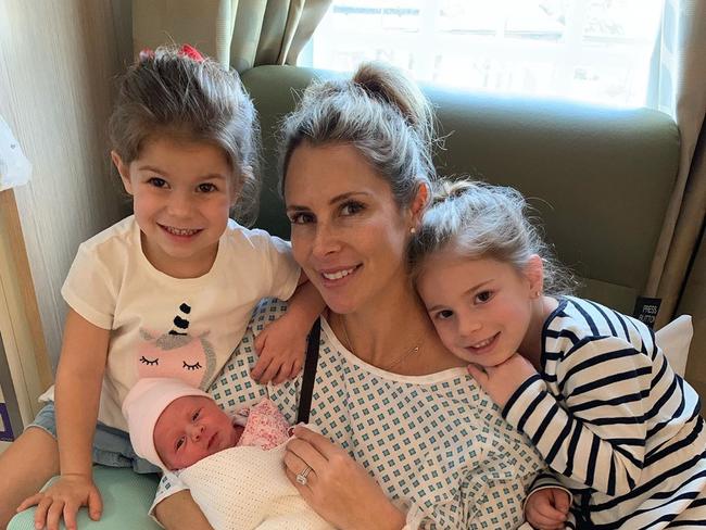 A radiant Candice Warner with her three daughters.