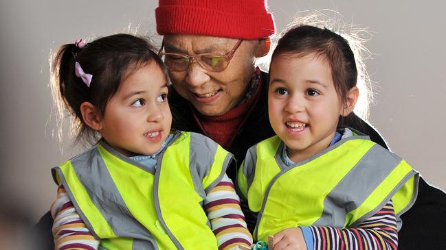 Chun Jian Fong with twins Penelope and Whillamina. Picture: Nicki Connolly