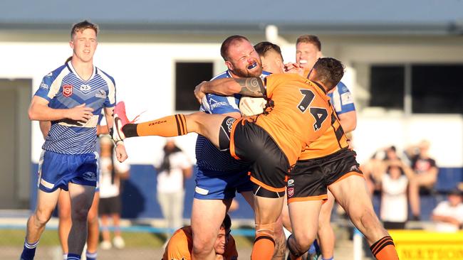 Tugun Seahawks (blue) vs. Southport Tigers at Tugun. A Grade. James Ryan tackled. 6 June 2021 Tugun Picture by Richard Gosling