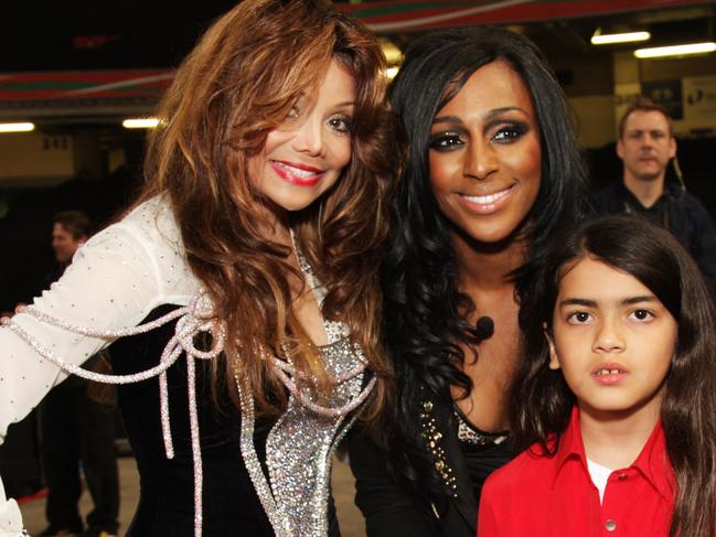 L-R La Toya Jackson, Alexandra Burke and Blanket Jackson backstage at the 'Michael Forever' concert in 2011. Picture: Getty