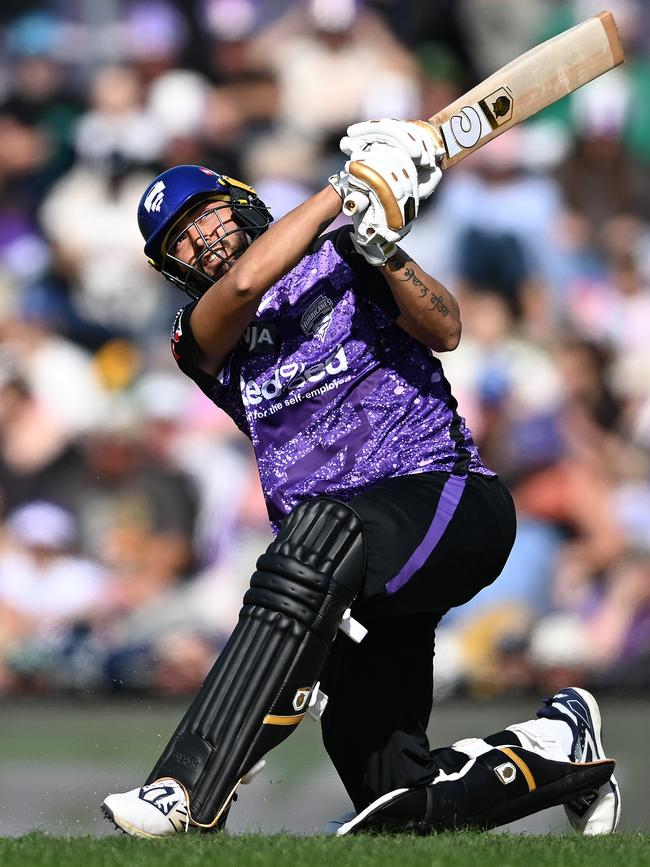 Nikhil Chaudhary of the Hurricanes hits a six during the BBL match between the Hobart Hurricanes and Sydney Sixers at Blundstone Arena, on January 01, 2025, in Hobart, Australia. (Photo by Steve Bell/Getty Images)