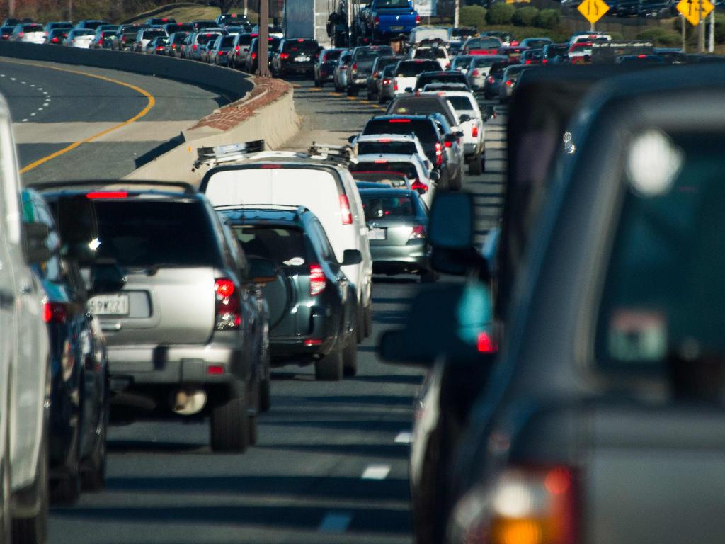 (FILES) In this file photo taken on November 25, 2015 Thanksgiving holiday traffic is seen coming to a crawl in Annapolis, Maryland. - Busy airports and serpentine queues at testing sites: many Americans plan to celebrate Thanksgiving with extended family on November 26, 2020 despite authorities warning they risk exacerbating the coronavirus pandemic engulfing the country. Stopping short of issuing an outright ban, the US government's health protection agency has for the first time called on Americans not to travel for the annual holiday, which sees families get together over turkey, yams and cranberry sauce and for many is more important than Christmas. (Photo by Jim WATSON / AFP)