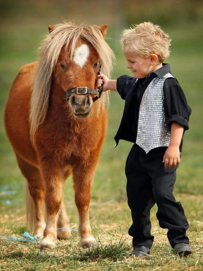 Cassius at age 3 with Munchkin the pony. Picture: Supplied