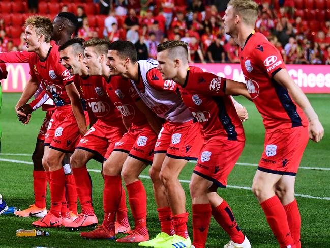 Adelaide United players celebrate their win on Friday night. Picture: Getty Images 