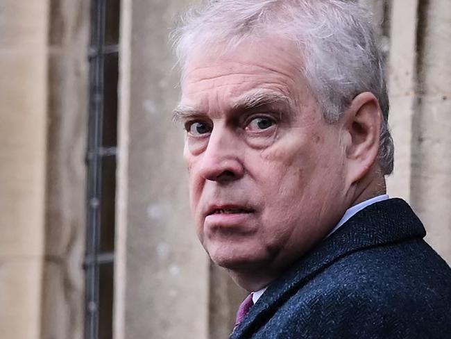 Britain's Prince Andrew, Duke of York reacts as he arrives for the Royal Family's traditional Christmas Day service at St Mary Magdalene Church in Sandringham, Norfolk, eastern England, on December 25, 2022. (Photo by Daniel LEAL / AFP)