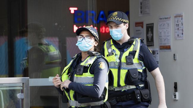 Protective service officers leave the Brady Hotel in Melbourne. Picture: David Geraghty