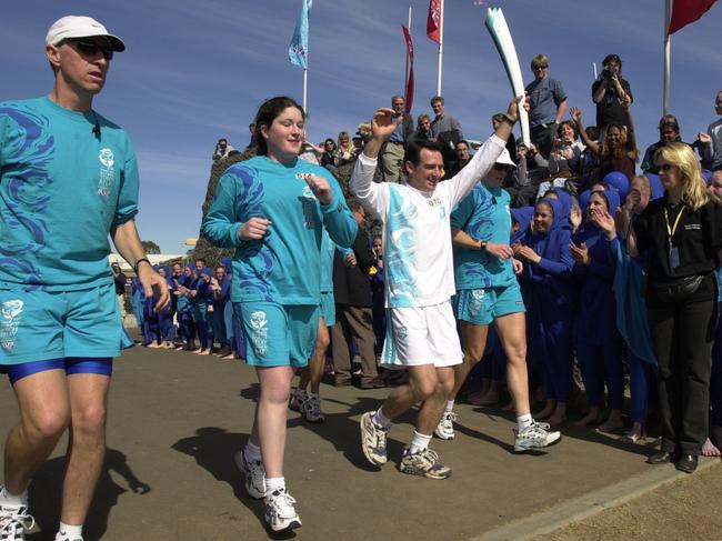 September 4, 2000: Athlete &amp; marathon runner Pat Farmer runs into Campbelltown Sports Stadium during Penrith to Bowral leg of Sydney 2000 Olympic Torch Relay. Picture: Robert McKell