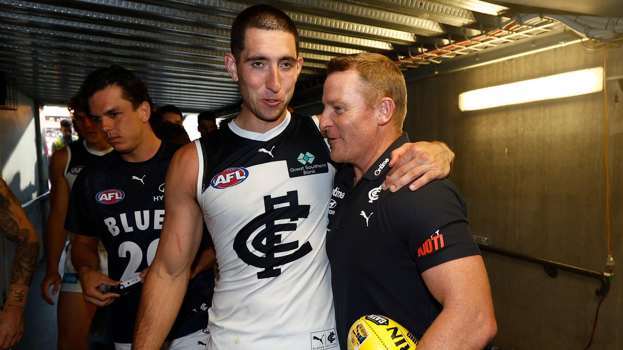 ADELAIDE, AUSTRALIA - APRIL 06: Jacob Weitering of the Blues and Michael Voss, Senior Coach of the Blues celebrate during the 2024 AFL Round 04 match between the Fremantle Dockers and the Carlton Blues at Adelaide Oval on April 06, 2024 in Adelaide, Australia. (Photo by Michael Willson/AFL Photos via Getty Images)