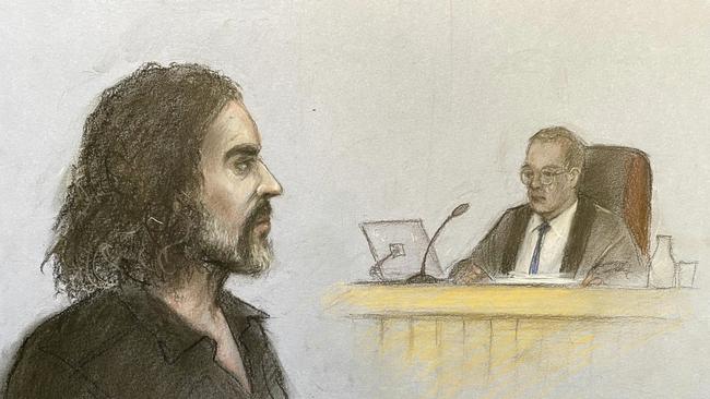 Another court drawing shows Russell Brand appearing in the dock. Picture: Elizabeth Cook/PA via AP