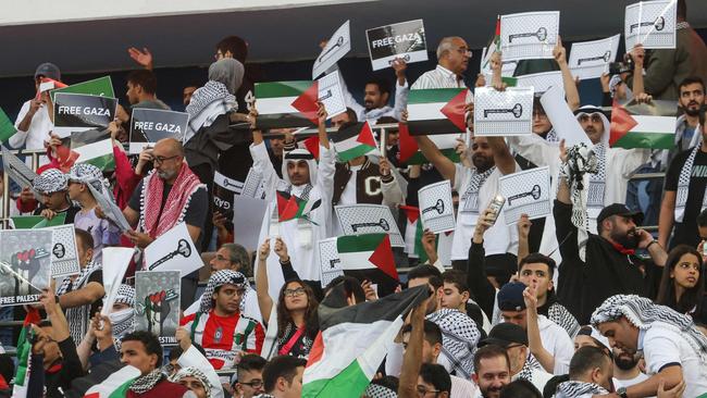 Palestinian fans show their support. Picture: Yasser Al-Zayyat / AFP