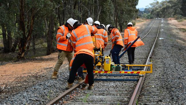 Workers on the Murray Basin Rail Project. This project to standardise rail from Mildura to Port is expected to improve the way produce gets to market.