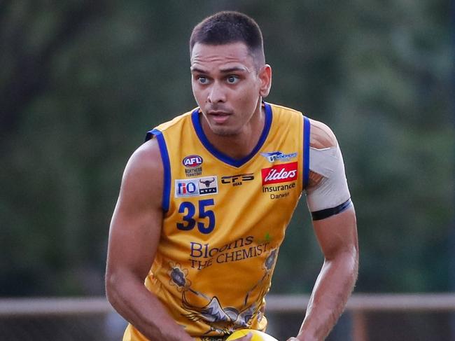 Matthew Motlop with ball in hand for Wanderers in the 2023-24 NTFL season. Picture: Celina Whan / AFLNT Media
