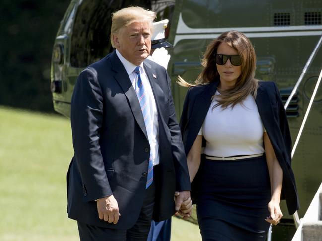 President Donald Trump and first lady Melania Trump arrive on the South Lawn of the White House in Washington, Wednesday, July 18, 2018. The president and the first lady are returning from Andrews Air Force Base after paying their respects to the family of fallen U.S. Secret Service special agent Nole Edward Remagen who suffered a stroke while on duty in Scotland. (AP Photo/Andrew Harnik)