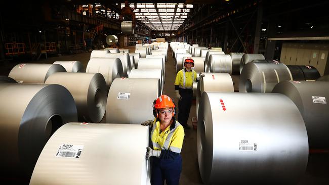 Workers Tamara Gluzman and Matthew Giles at BlueScope Steel’s plant at Port Kembla, NSW, yesterday. Picture: John Feder