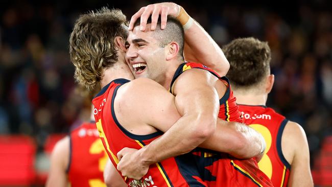 Riley Thilthorpe and Josh Rachele celebrate against Essendon. Picture: Michael Willson/AFL Photos via Getty Images