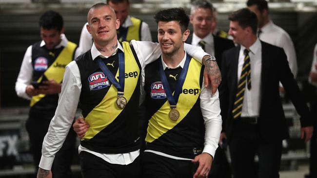 Martin and Cotchin arm in arm after winning the 2019 premiership. Picture: Michael Klein.