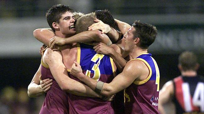 JUNE 2, 2001 : Players celebrates after Brisbane Lions defeated Essendon in their AFL game at Gabba ground, 02/06/01. Pic David Kapernick.Australian Rules