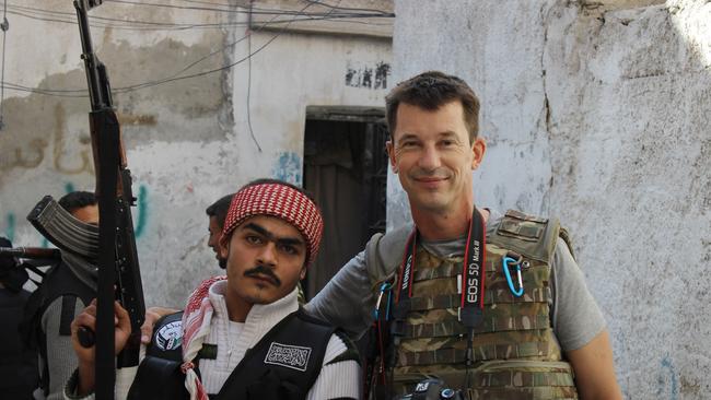 Cantlie poses with a Free Syrian Army rebel in Aleppo, Syria, in 2012.