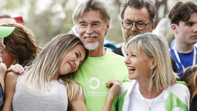 Olivia with her family Chloe and John Easterling at the Wellness Walk and Research Run in 2019.