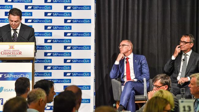 SA Best leader Nick Xenophon (left) speaks while South Australian Premier Jay Weatherill (centre) and South Australian Opposition Leader Stephen Marshall watch on at the SA Press Club for the leaders' public debate last week. (AAP Image/Roy Vandervegt)