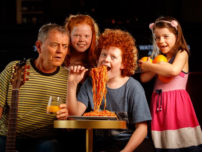 Peter Combe with his grandchildren Oliver 11, Eliza 10 and Holly 6 at Her Majesty's Theatre on October 15, 2020. Peter Combe will perform the first family-friendly concert at Her Majesty's Theatre, since it's $66m upgrade. Picture Matt Turner.