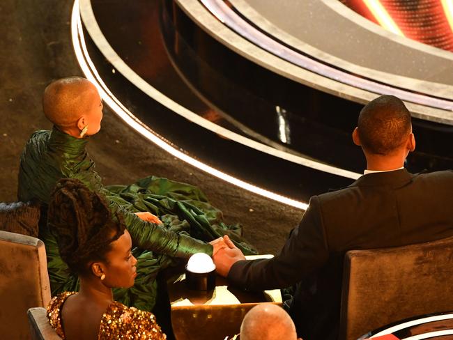 Will Smith and Jada Pinkett Smith held hands for the rest of the night following the incident. Picture: AFP