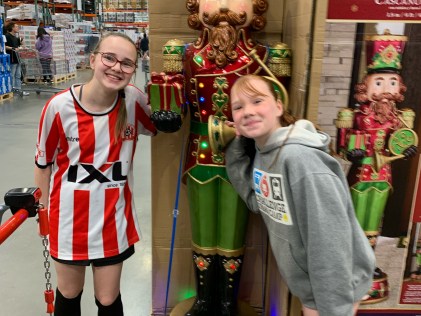 Georgia wearing her club's jersey with one of her little sisters. Picture: Supplied