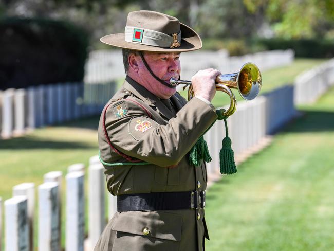 ADELAIDE, AUSTRALIA - NewsWire Photos NOVEMBER 11, 2020: A lone bugler Al Kidney from the ADF plays the Last Post during the Service of Remembrance under the Cross of Sacrifice in the AIF section of West Terrace Cemetery. Picture: NCA NewsWire / Brenton Edwards