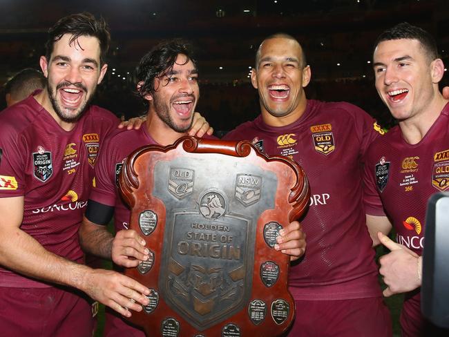 (L-R) Maroons stars Aidan Guerra, Johnathan Thurston, Will Chambers and Boyd celebrate victory after the 2015 Origin series. Picture: Getty Images