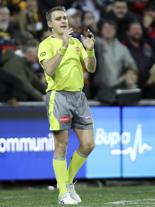 Umpire Andrew Mitchell calls for a score review after the Josh Jenkins goal. Picture: Sarah Reed