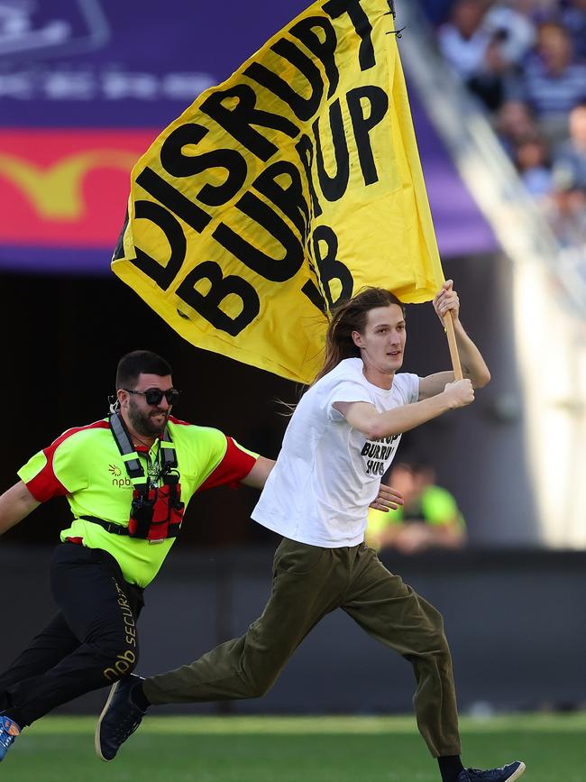 Mr Davey was flying a ‘Disrupt Burrup Hub’ flag, calling attention to the impacts of Woodside Energy’s Burrup Hub LNG project. Picture: Paul Kane/Getty Images